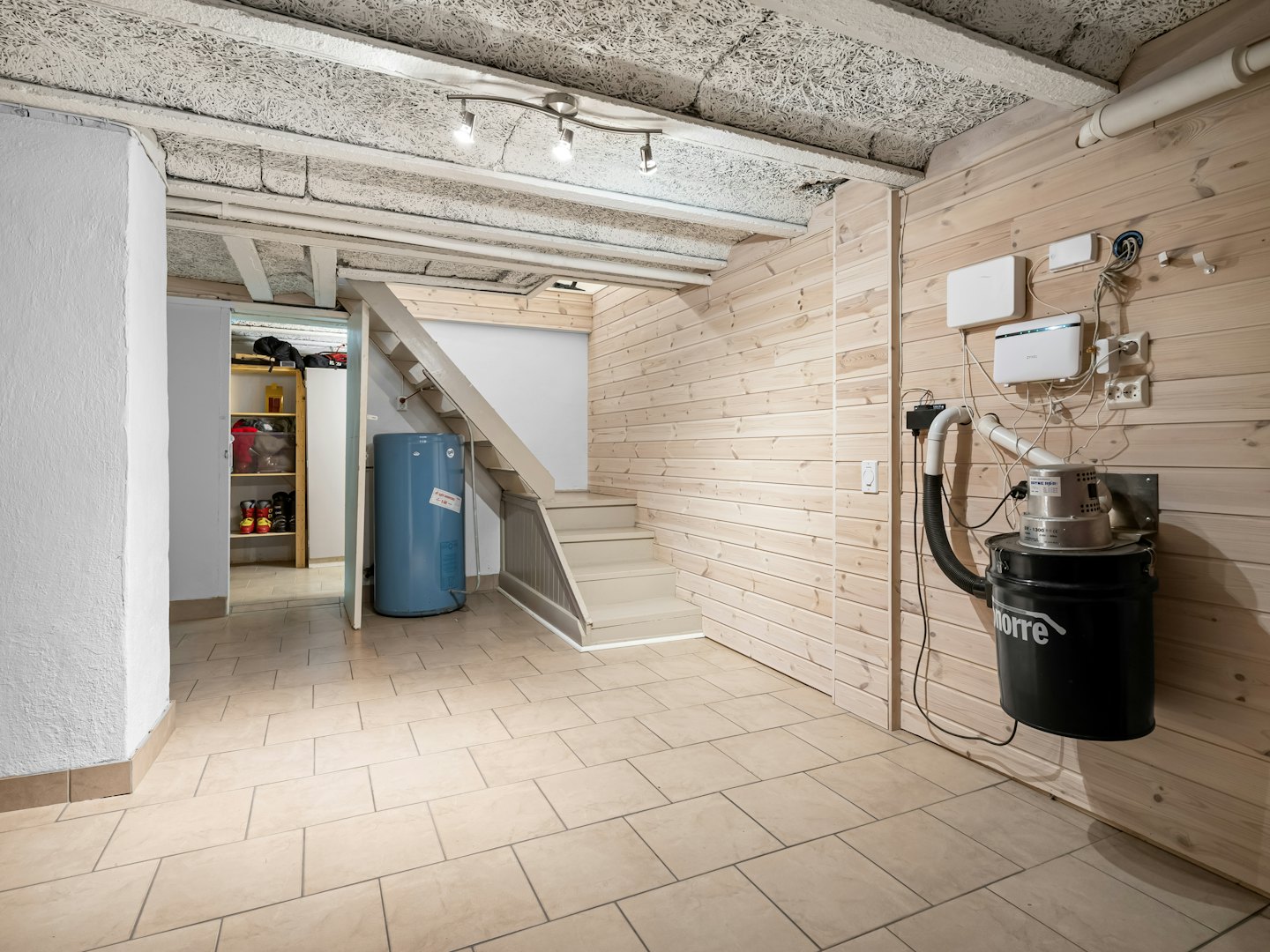 Mechanical utility room with water heater and wall-mounted equipment.